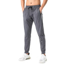 Pantalones de chándal de gimnasio para hombre, pantalones finos de Fitness, pantalones largos ajustados de secado rápido para correr, pantalones elásticos de entrenamiento para hombre