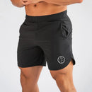 Muscleguys-pantalones cortos ajustados para hombre, pantalón de chándal de secado rápido para culturismo y Fitness