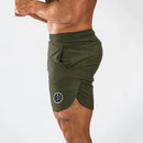 Muscleguys-pantalones cortos ajustados para hombre, pantalón de chándal de secado rápido para culturismo y Fitness