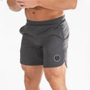 Muscleguys-pantalones cortos ajustados para hombre, pantalón de chándal de secado rápido para culturismo y Fitness