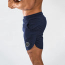 Muscleguys-pantalones cortos ajustados para hombre, pantalón de chándal de secado rápido para culturismo y Fitness