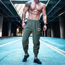 Pantalones deportivos para culturismo y gimnasio, pantalones de entrenamiento informales transpirables para hombre, pantalones de chándal finos sueltos de secado rápido con puños para correr