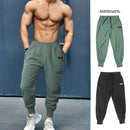 Pantalones deportivos de culturismo para hombre, pantalón de entrenamiento informal, cintura elástica, ultrafino, secado rápido, cintura alta, largo, suelto
