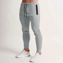 Pantalones para correr de gimnasio para hombre, pantalones de chándal ajustados para entrenamiento y correr con bolsillos con cremallera, pantalones con cordón, pantalones casuales deportivos de entrenamiento